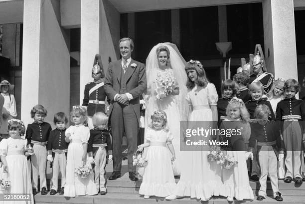 Camilla Shand and Major Andrew Parker-Bowles pose with their pageboys and bridesmaids after their wedding at the Guards Chapel, Wellington Barracks,...