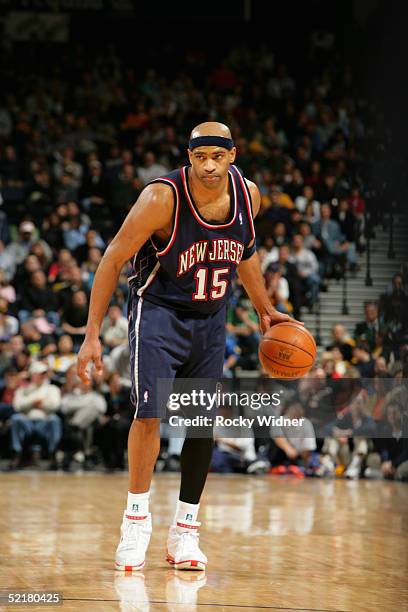 Vince Carter of the New Jersey Nets moves the ball during the game with the Golden State Warriors at the Arena in Oakland on January 26, 2005 in...