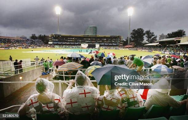 England fans look on as rain stops play during the sixth one day international match between South Africa and England at the Kingsmead Cricket Ground...