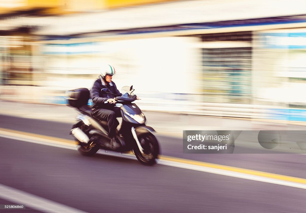 Driving scooter at the city