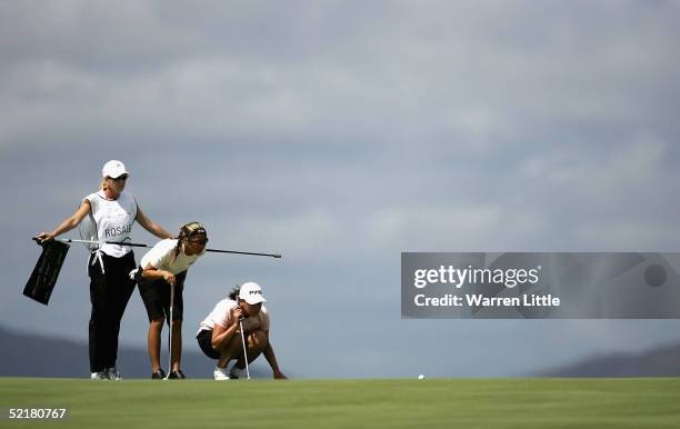 Jennifer Rosales of the Phillippines lines up a putt on the 10th green with her compatriot Dorothy Delesin during the 2005 Women's World Cup of Golf...