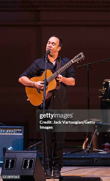 South African-born American musician Dave Matthews plays guitar as he performs onstage at the 'Twenty Years of Freedom' concert during the 'Ubuntu:...