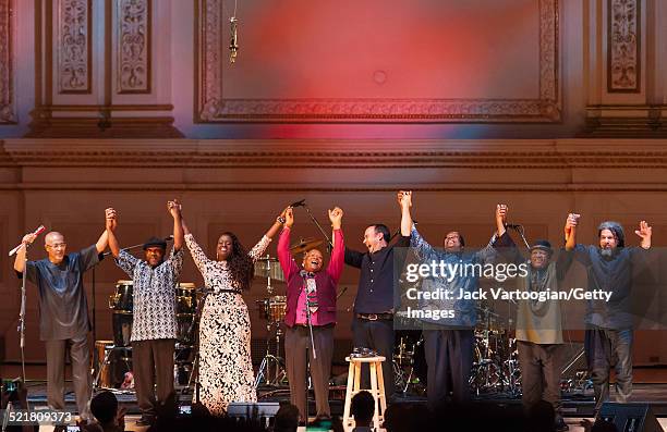 South African composer, bandleader, and musician Hugh Masekela and his band take a bow at the end of the 'Twenty Years of Freedom' concert during the...