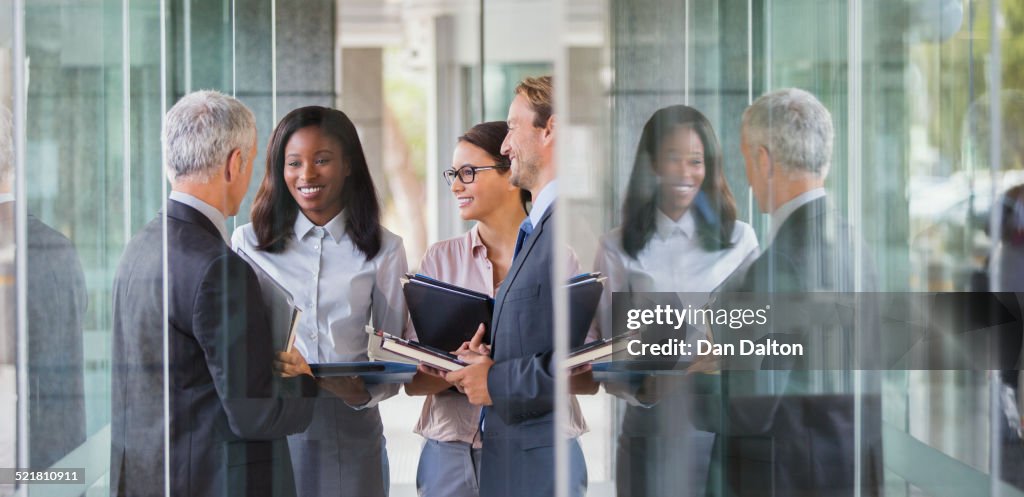 Business people talking in office building