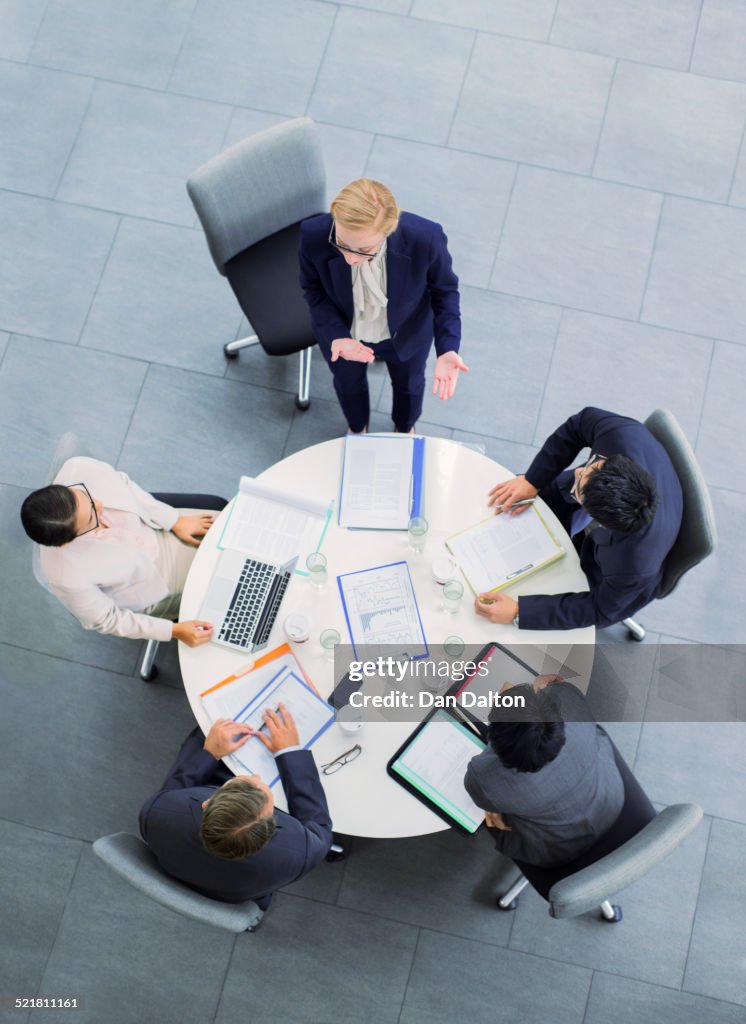 Business people talking in meeting at table