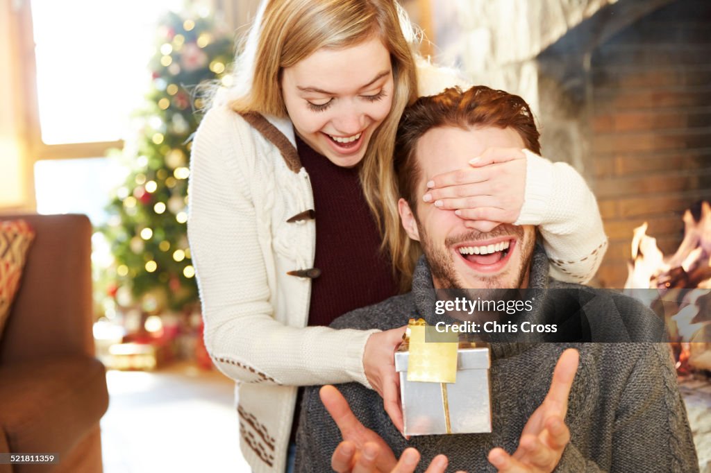 Couple exchanging gifts on Christmas