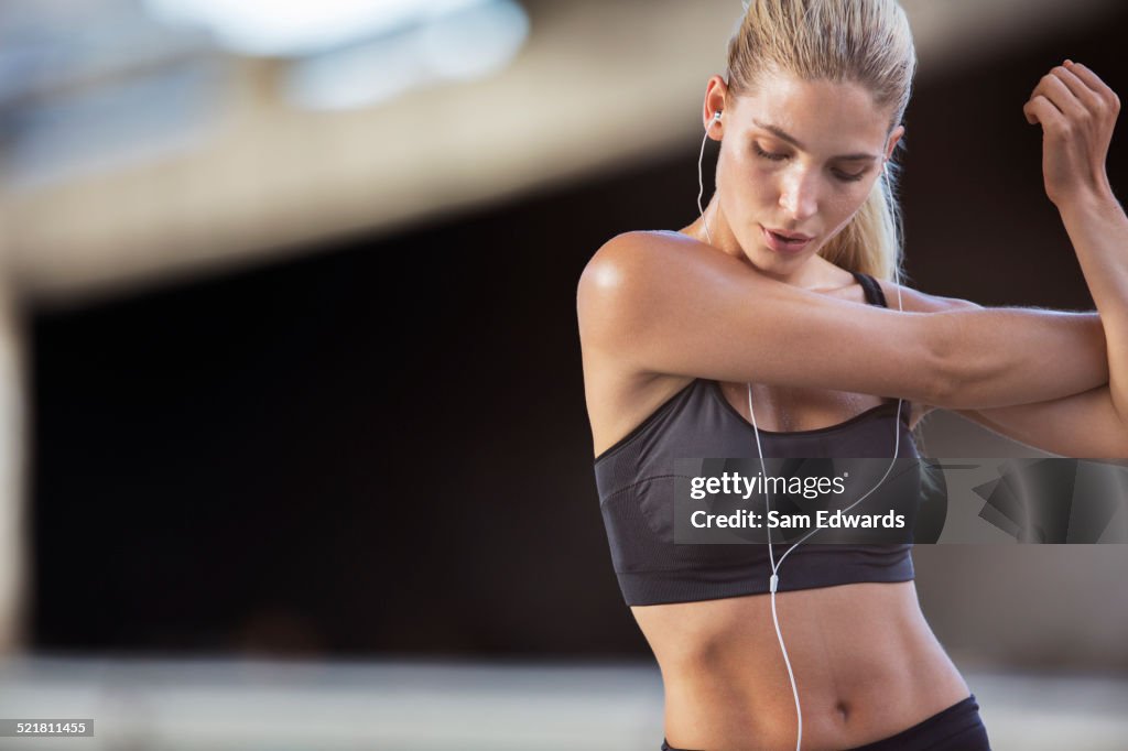 Woman stretching arms before exercise