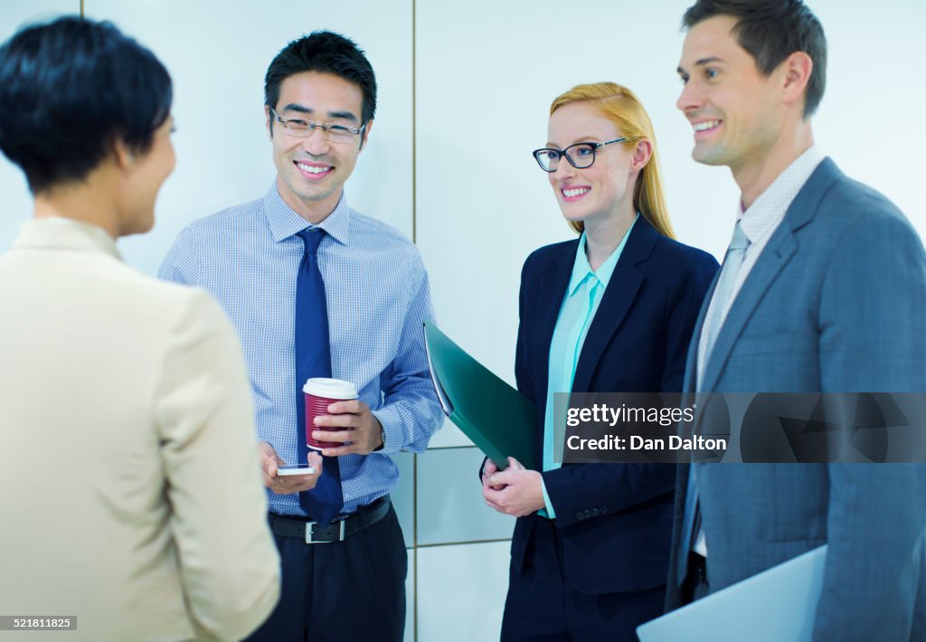 Business people talking in office building