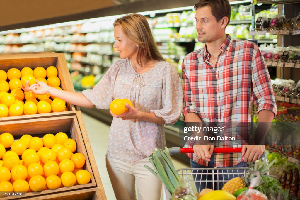 Couple shopping together in grocery store