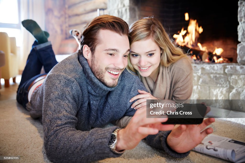 Couple looking at cell phone together