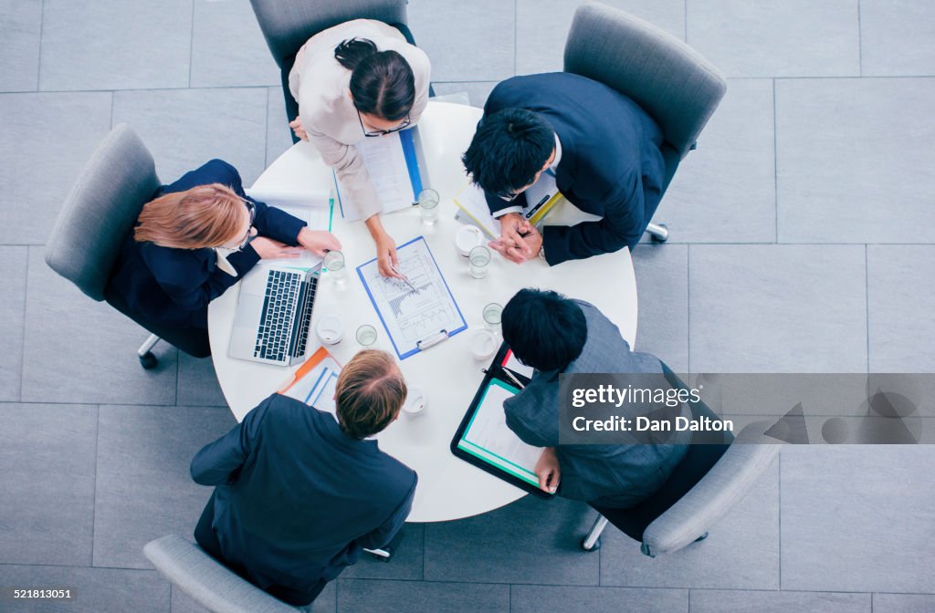Business people talking in meeting at table