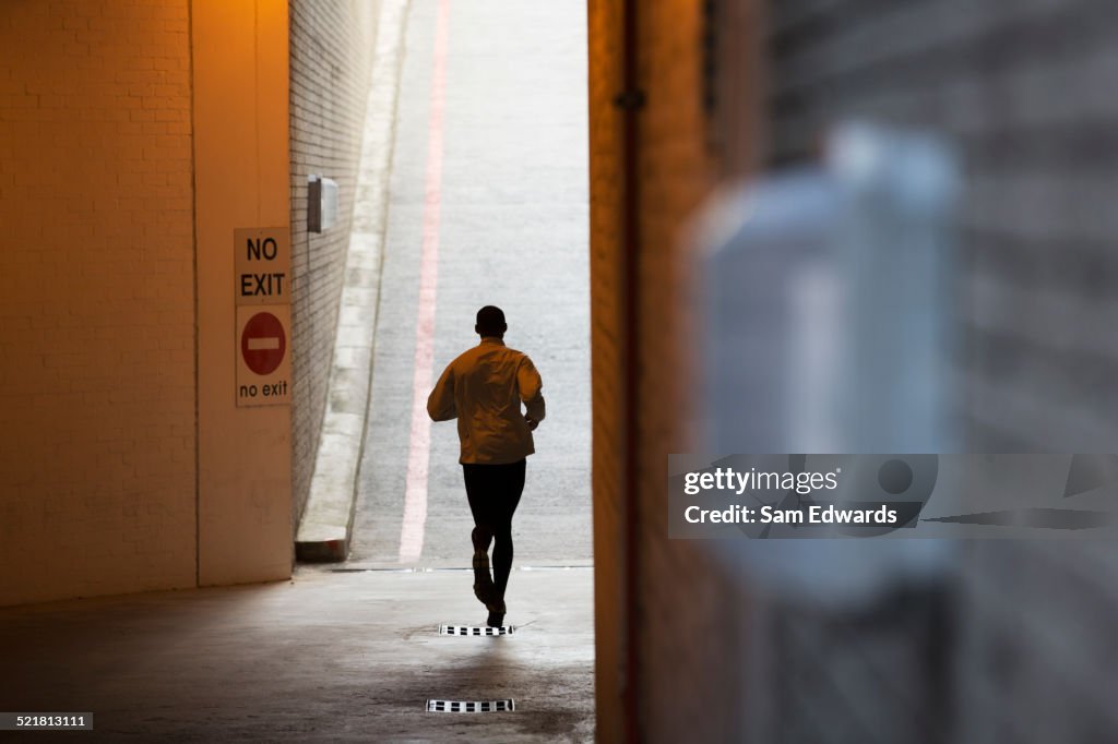 Man running through city streets