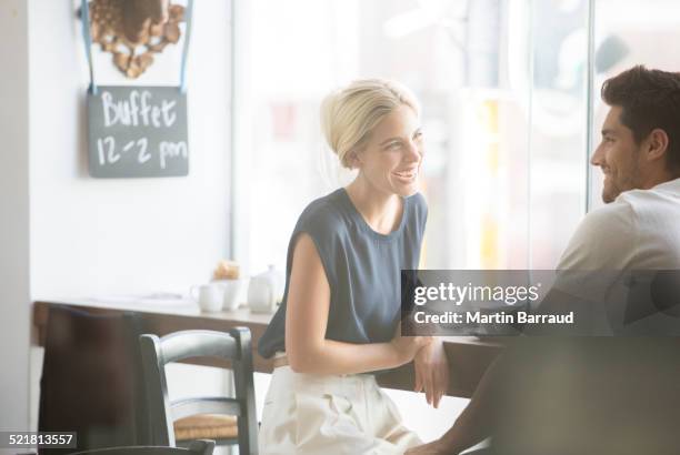 Couple talking in cafe