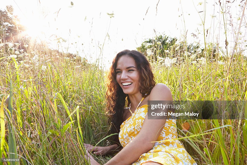 Woman in field of wildflowers