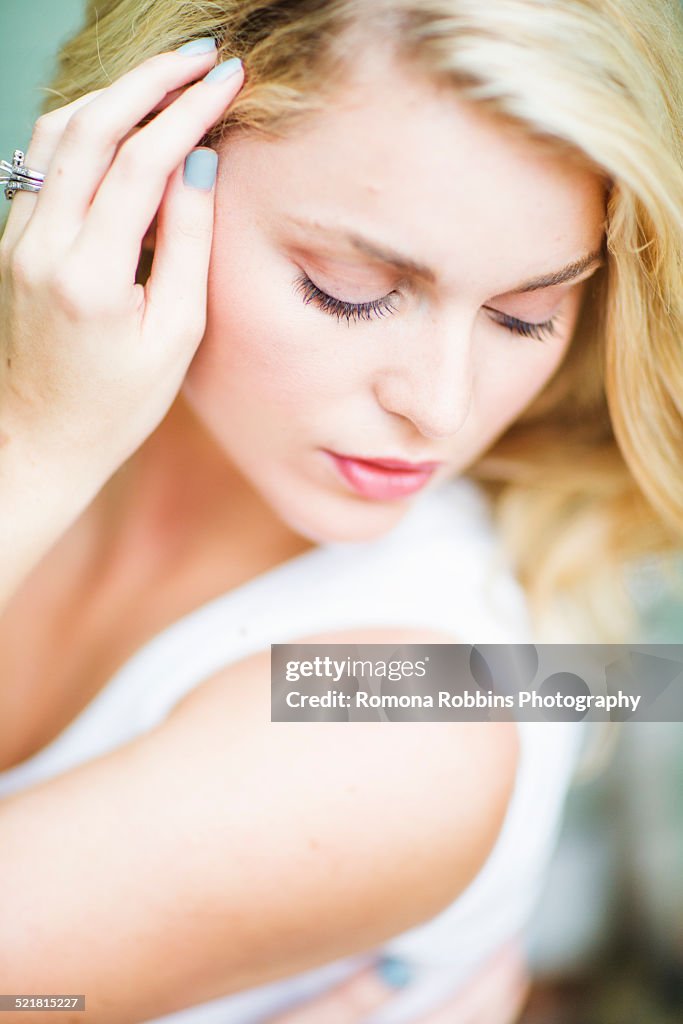 Portrait of a young woman, looking down