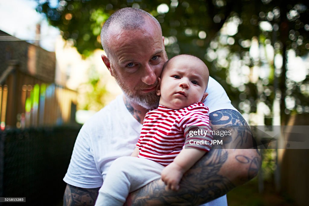 Father holding baby son