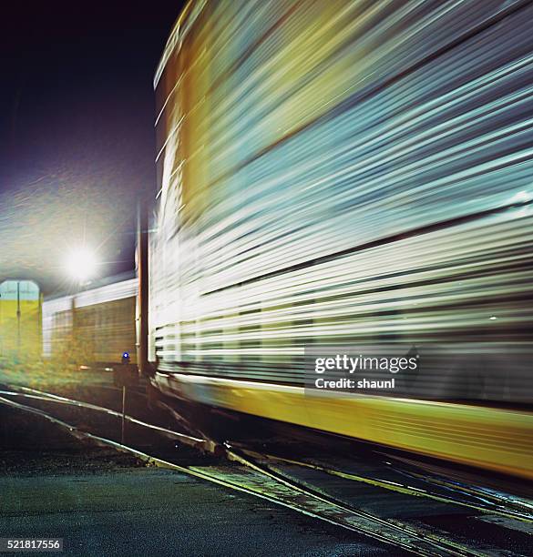 blur of industry - train yard at night stock pictures, royalty-free photos & images