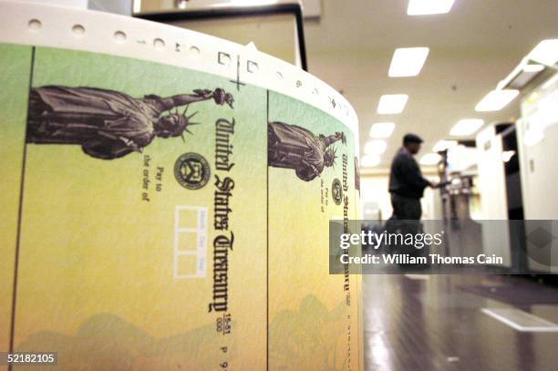 Larry Thompson monitors as blank Social Security checks are run through a printer at the U.S. Treasury printing facility February 11, 2005 in...