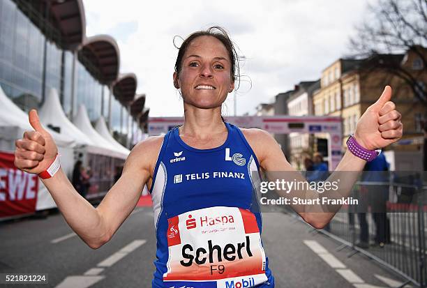 Anja Scherl of Germany celebrates after coming third place in the ladies race of the Haspa Hamburg marathon on April 17, 2016 in Hamburg, Germany.