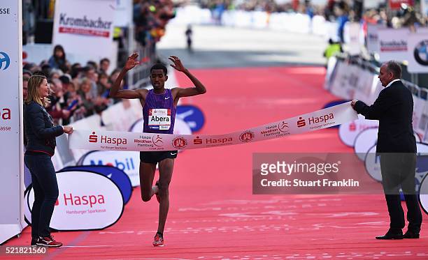 Tesfaye Abera of Ethiopia celebrates winning the Haspa Hamburg marathon on April 17, 2016 in Hamburg, Germany.