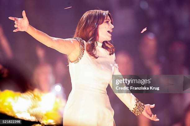 Andrea Berg performs at the 'Das grosse Schlagerfest - Die ueberraschende Show der Besten mit Florian Silbereisen' on April 16, 2016 in Halle,...