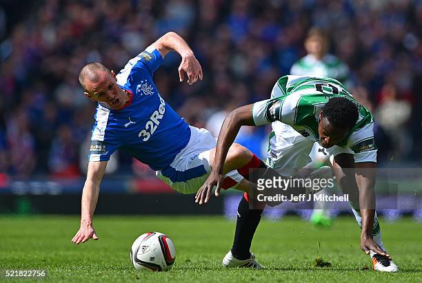 Kenny Miller of Rangers is tackled by Dedryck Boyata of Celtic during the William Hill Scottish Cup semi final between Rangers and Celtic at Hampden...