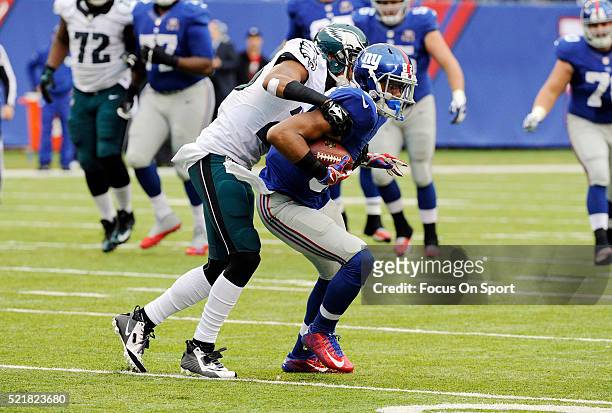 Rueben Randle of the New York Giants gets tackled by Cary Williams of the Philadelphia Eagles during an NFL football game at MetLife Stadium on...
