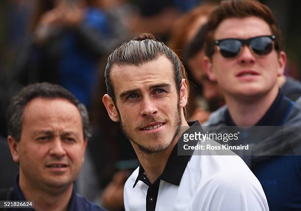 Real Madrid and Wales footballer Gareth Bale looks on as he watches Sergio Garcia's group during the final round on day four of the Open de Espana at...