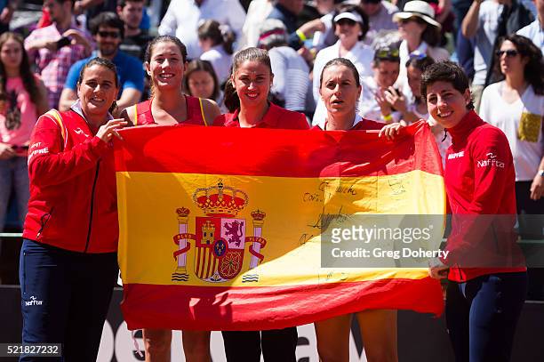Captain Conchita Martinez, Garbine Muguruza, Sara Sorribes, Anabel Medina and Carla Suarez Navarro of Spain celebrate defeating Italy during day two...