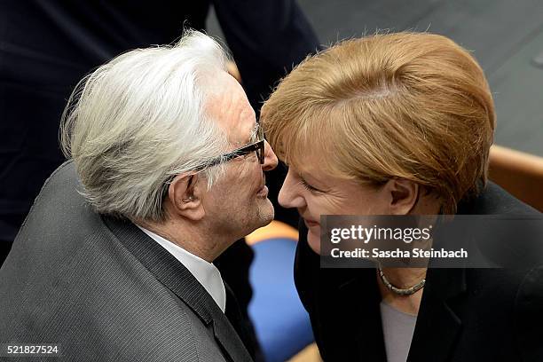 Roland Dumas and Angela Merkel attend the state memorial ceremony to honor Hans-Dietrich Genscher at World Congress Center on April 17, 2016 in Bonn,...