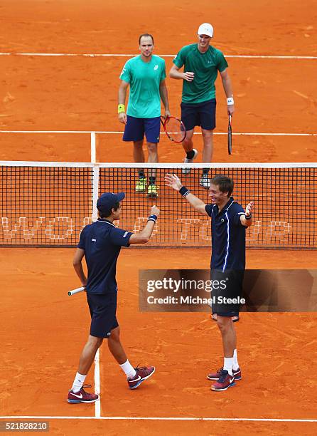 Nicolas Mahut of France and Pierre Hugues Herbert of France celebrate victory over Bruno Soares of Brazil and Jamie Murray of Great Britain in the...