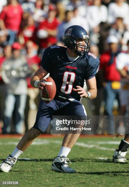 Richard Kovalcheck of the Arizona Wildcats looks to pass during the game against the Arizona State Sun Devils at Arizona Stadium on November 26, 2004...