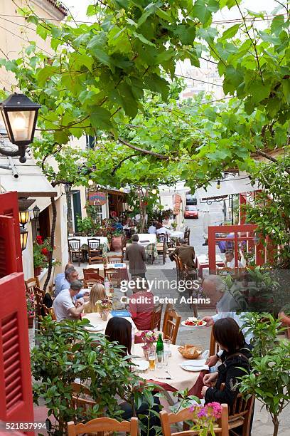 sidewalk cafe in athens - plaka stock pictures, royalty-free photos & images