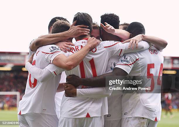 Roberto Firmino of Liverpool celebrates after scoring the opening goal during the Barclays Premier League match between A.F.C. Bournemouth and...