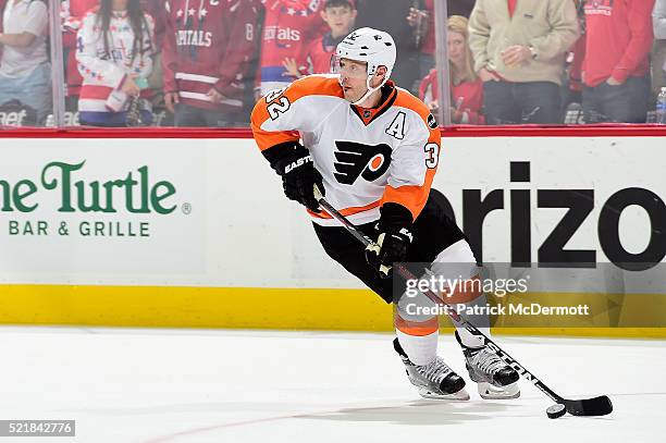 Mark Streit of the Philadelphia Flyers skates with the puck against the Washington Capitals in the third period in Game One of the Eastern Conference...