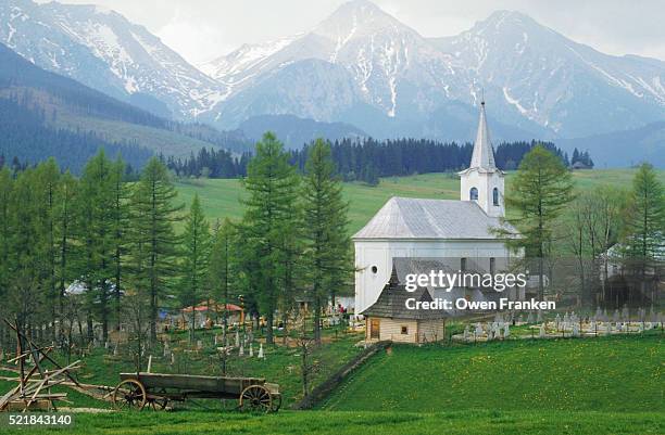mountains and tree surrounding church - slovakia country stock pictures, royalty-free photos & images