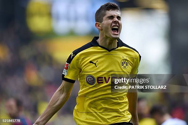 Dortmund's midfielder Christian Pulisic celebrates scoring the 1-0 goal during the German Bundesliga first division football match BVB Borussia...