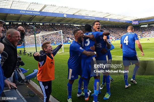 Leonardo Ulloa of Leicester City celebrates with team mates after scoring his team's second goal of the game from the penalty spot during the...