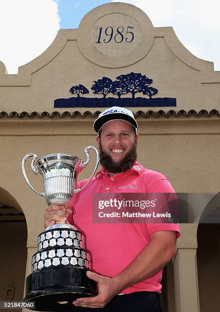 Andrew Johnston of England celebrates with the trophy after victory during the final round of the Open de Espana at Real Club Valderrama on April 17,...