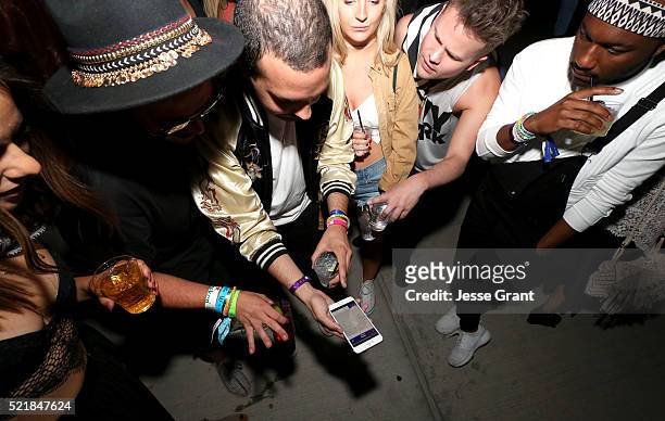 Party goers attend the Levi's Brand and RE/DONE Levi's presents NEON CARNIVAL with Tequila Don Julio on April 16, 2016 in Thermal, California.