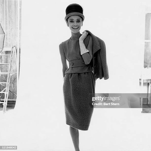 Audrey Hepburn, actress, modeling tweed suit by Givenchy.