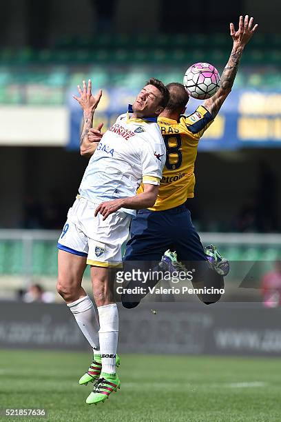 Evangelos Moras of Hellas Verona FC clashes with Daniel Ciofani of Frosinone Calcio during the Serie A match between Hellas Verona FC and Frosinone...