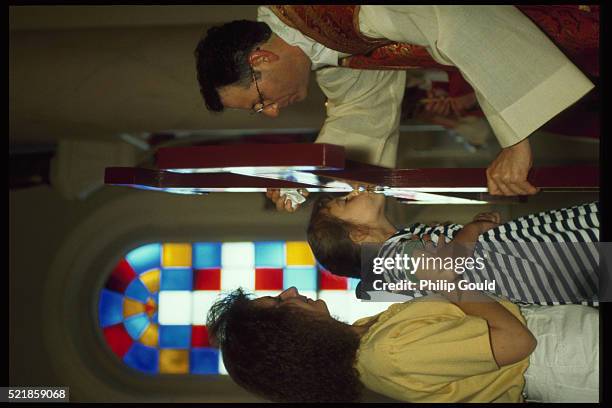 veneration of the cross in st. martin of tours church - st-martin-of-tours-catholic-church stock pictures, royalty-free photos & images