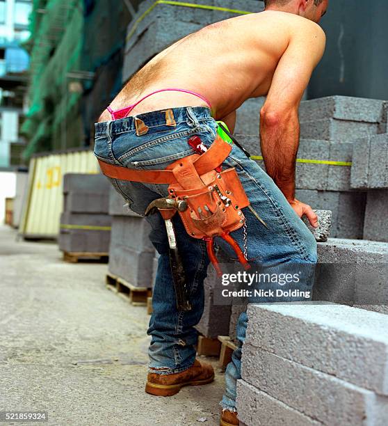 builder wearing g-string - panties stock-fotos und bilder