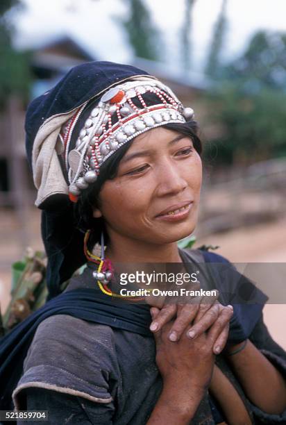 akha woman with hands clasped - akha stock pictures, royalty-free photos & images
