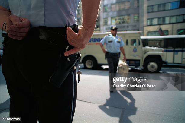 armored car delivery guards holding their handguns - armoured truck stock pictures, royalty-free photos & images