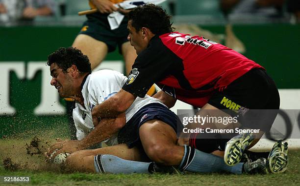 Morgan Turinui of the Waratahs scores a try during the Super 12 trial match between the NSW Waratahs and the Crusaders at Aussie Stadium February 12,...