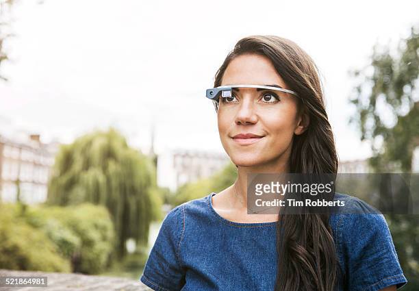 young woman with wearing smart glass. - smart glasses stock pictures, royalty-free photos & images