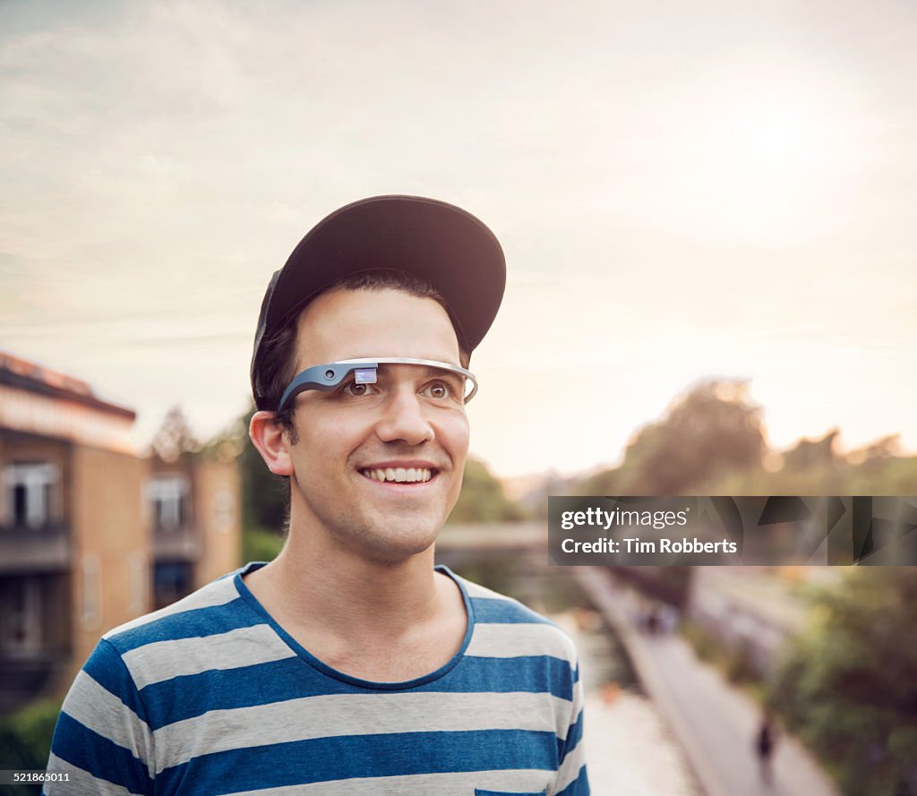 Young man wearing smart glass.