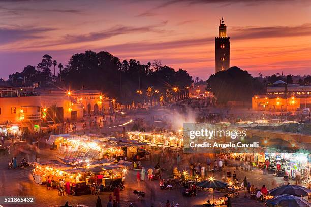 vendors at place jema al-fna at dusk - marrakesh stock pictures, royalty-free photos & images